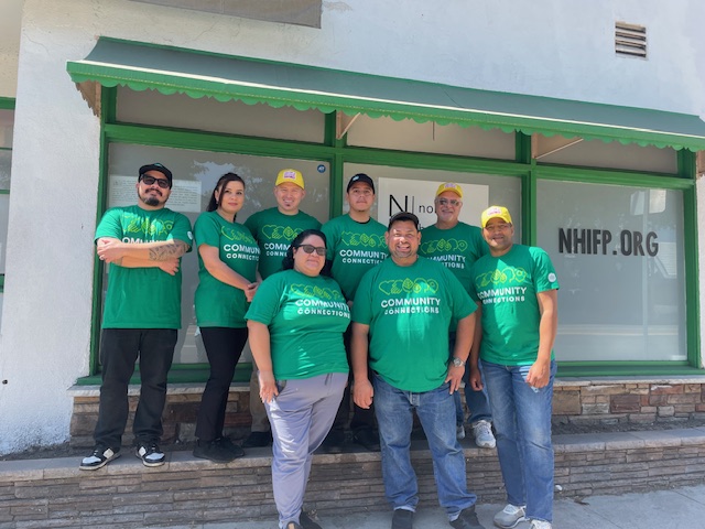 Doing meaningful work: North Hollywood Interfaith Food Pantry (NIFP) volunteers pose (left after organizing food in partnership with whole Foods. Volunteers organize food donations (right) during a dedicated charity day at NHIFP.
